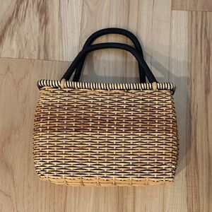 The Sak Stylish Wicker Tan Woven Handbag with Black Handles and Interior